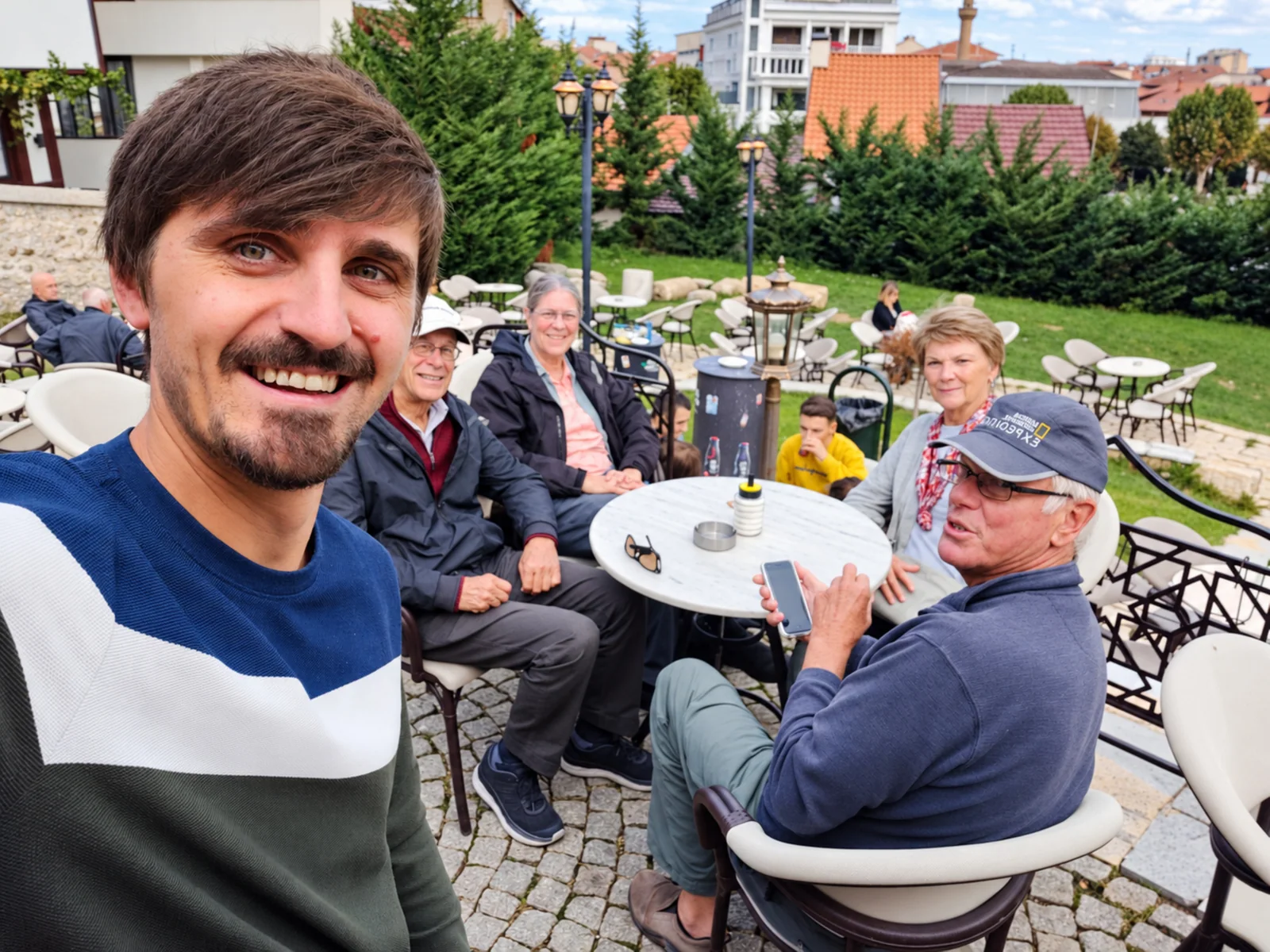 Travelers gathering and enjoying the scenic outdoors in Kosovo