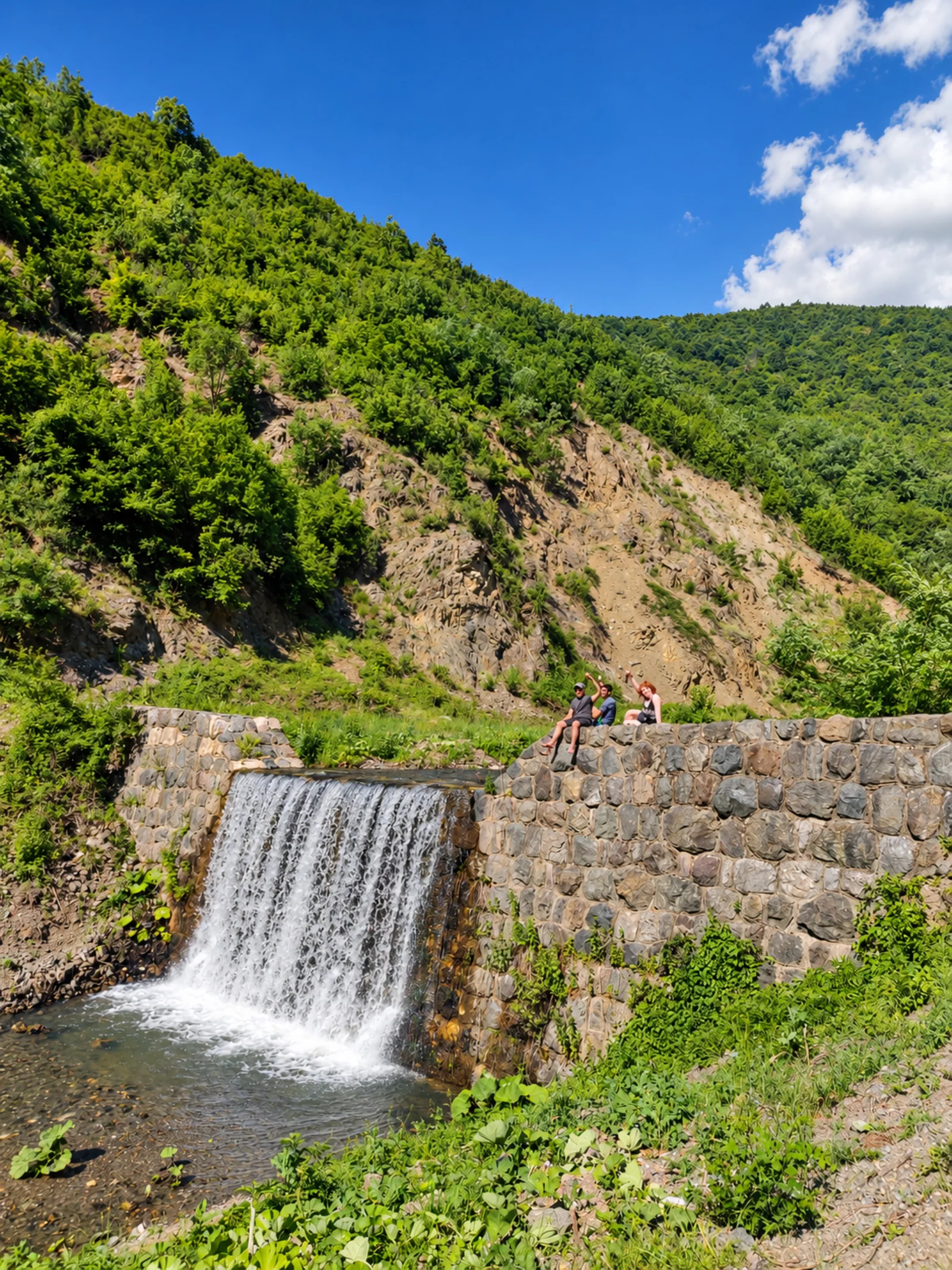 Travelers enjoying panoramic mountain views on an outdoor journey in Kosovo